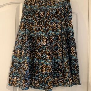 Style&Co size 10 line skirt. Side zipper brown skirt with shades of blue/browns